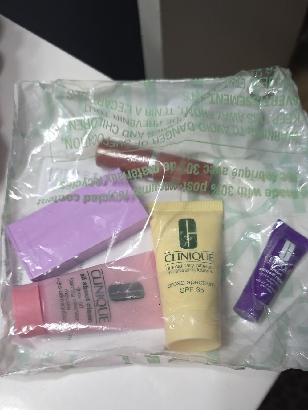 Clinique Skincare & Makeup Sample Set - Pink, Yellow, Purple